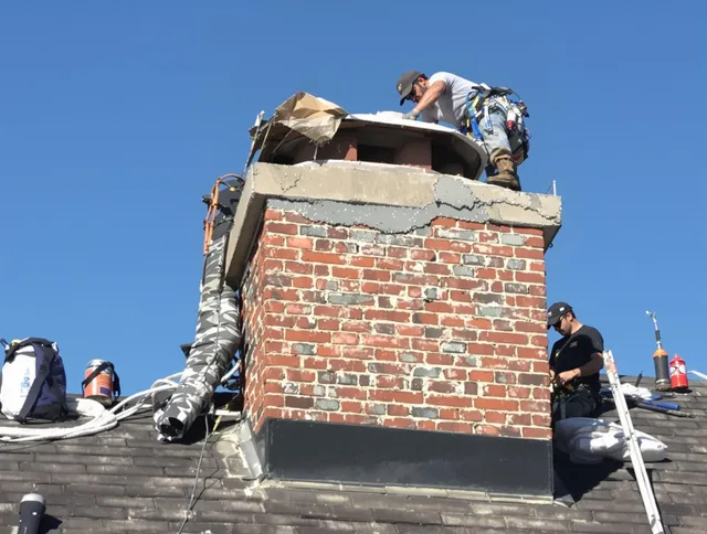 Cleveland Chimney Sweep installing a custom chimney crown in Cleveland, OH