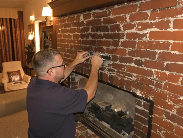 Cleveland Chimney Sweep expert fixing a fireplace in Cleveland, OH